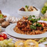 Fried chicken leg with tomato, chili, fried onion, lettuce, corn Fried chicken leg with tomato, chili, fried onion, lettuce, corn, and needle mushroom.